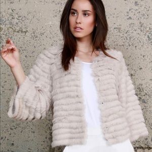 Authentic Dolce Cabo fur coat. New with tags.